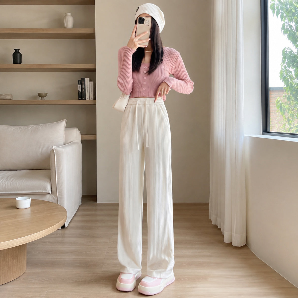 Wide-leg trousers styled in an everyday setting